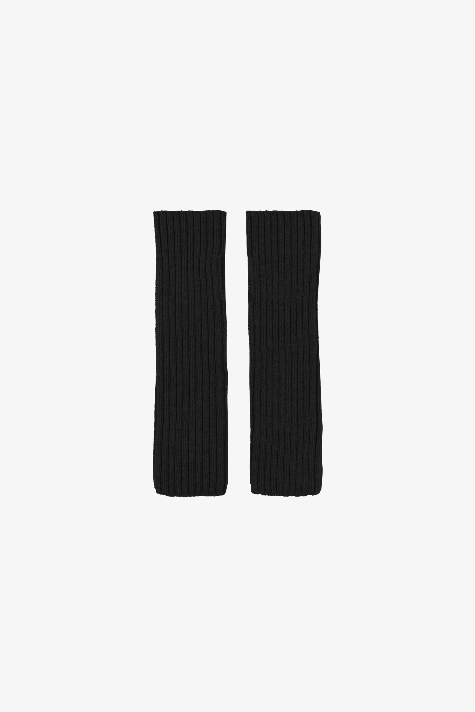 Two black arm warmers on a white background